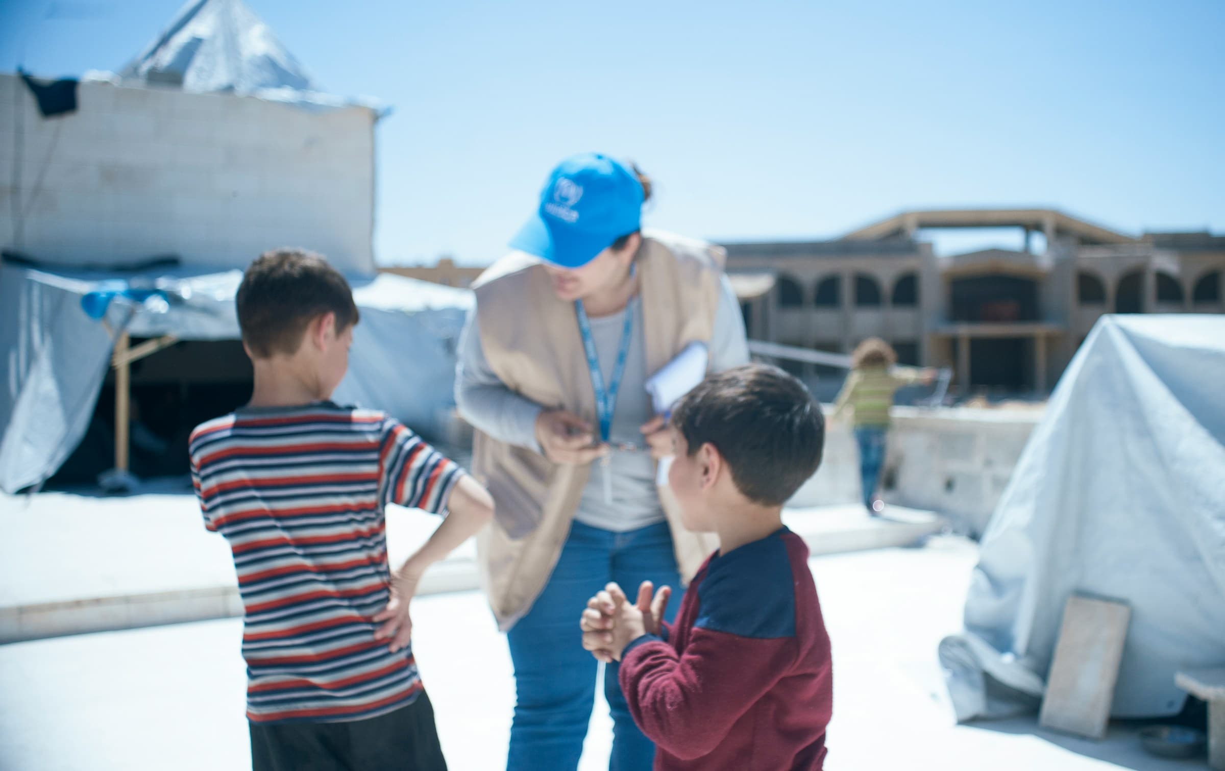 UNHCR worker with children